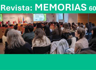 Conference room with panelists at a long table on stage beneath a teal banner reading 'Revista: MEMORIAS 60', and an audience seated facing them in rows.
